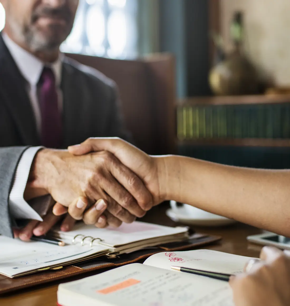 A client meeting with an attorney at the firm
